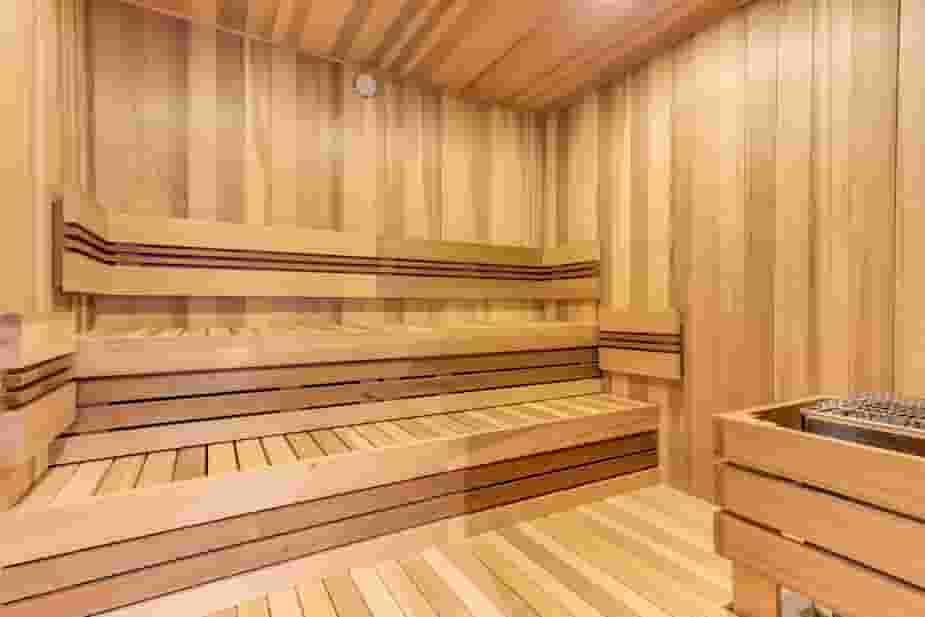 Sauna room with real wood walls